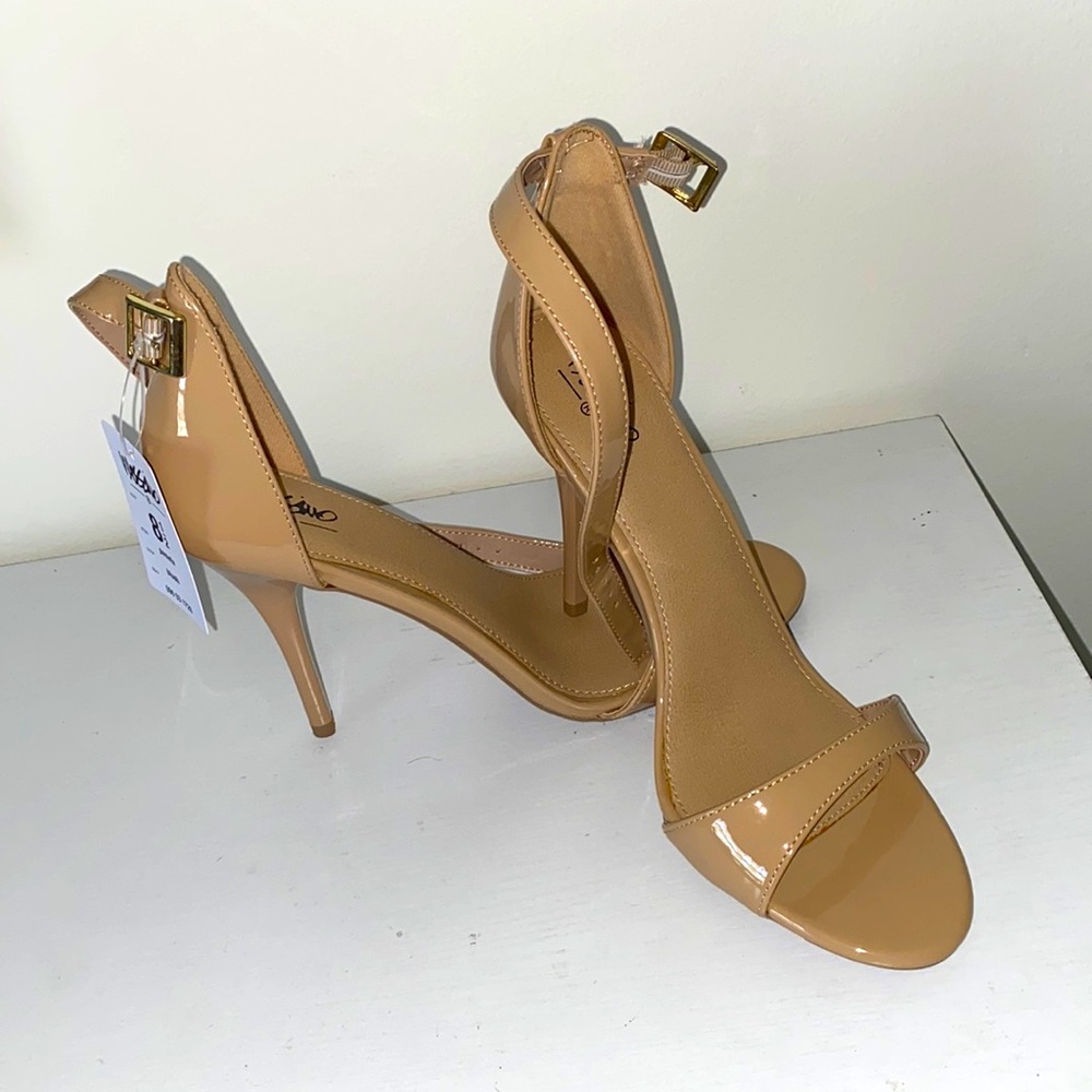 New, never worn patent open toe pumps